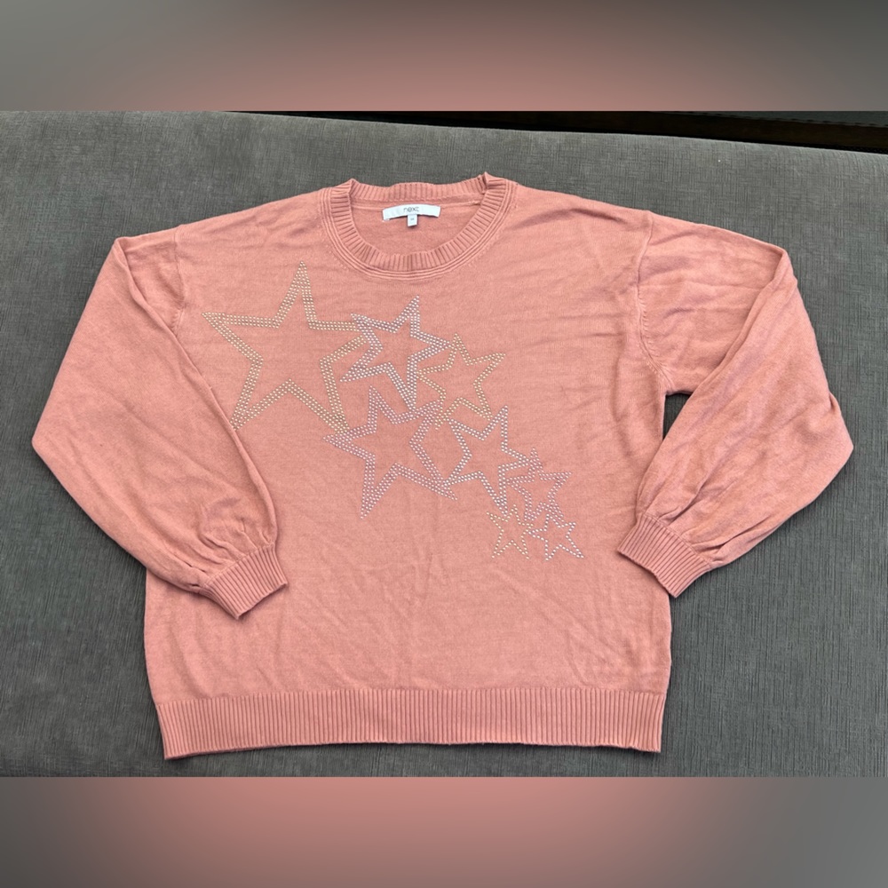 Blush pink sweater with star pattern embellishments